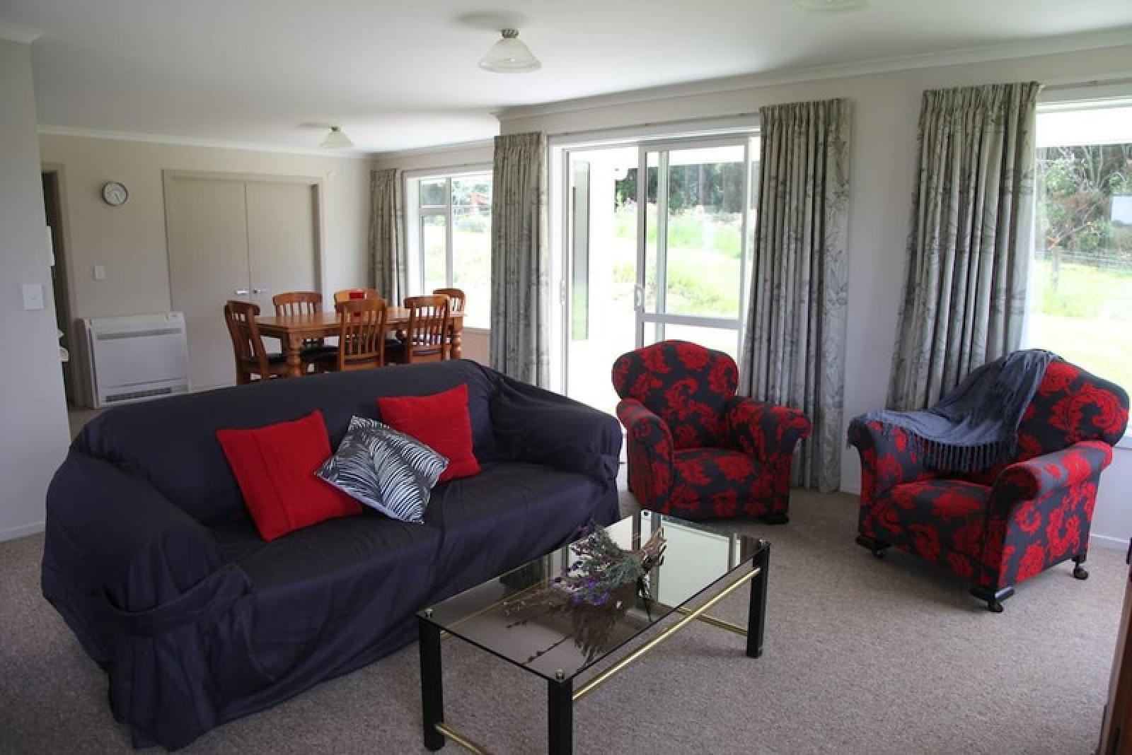 Open plan living room, the sofa pulls out to a double bed.